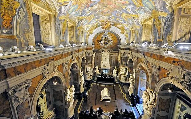 The nave of the Cappella Sansevero, its side arches lined with marble monuments under the painted vault